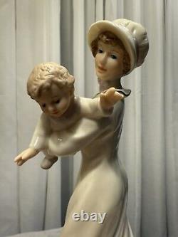 Marianne's Vintage porcelain figurine of a lady with a baby and cat B8