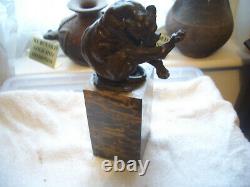 Vintage bronze of a big cat biting at a thorn in leg signed on marble base