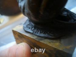 Vintage bronze of a big cat biting at a thorn in leg signed on marble base