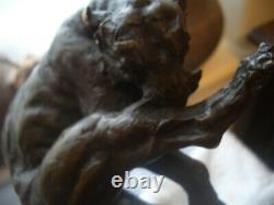 Vintage bronze of a big cat biting at a thorn in leg signed on marble base