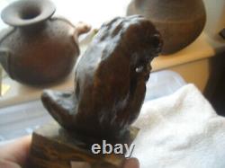 Vintage bronze of a big cat biting at a thorn in leg signed on marble base