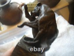 Vintage bronze of a big cat biting at a thorn in leg signed on marble base