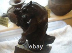 Vintage bronze of a big cat biting at a thorn in leg signed on marble base